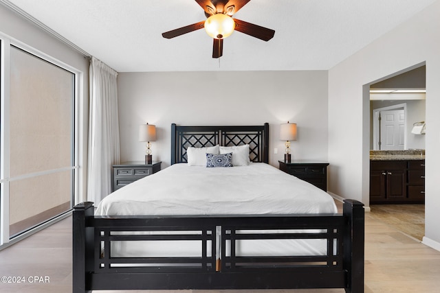 bedroom with ceiling fan and light wood-type flooring