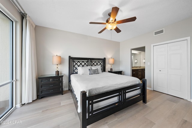 10254 E County Highway 30a Unit 333, Rosemary Beach, FL 32461 - bedroom with light wood-style flooring, ensuite bath, and ceiling fan