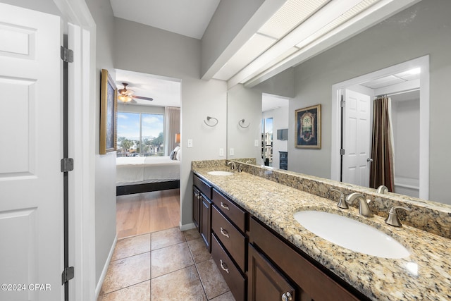 bathroom featuring vanity, tile patterned flooring, and ceiling fan