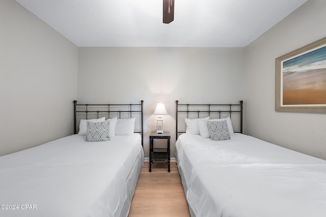 bedroom featuring light wood-type flooring and ceiling fan