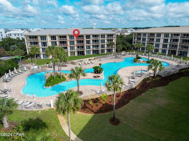 view of swimming pool featuring a lawn and a patio area