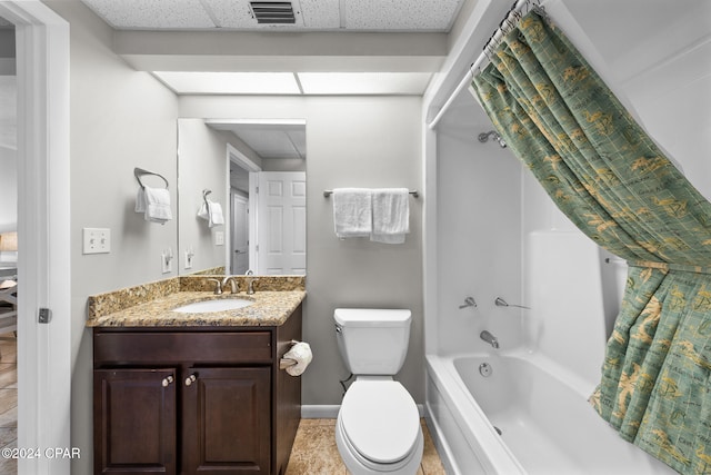 full bathroom featuring tile patterned flooring, vanity, toilet, and  shower combination