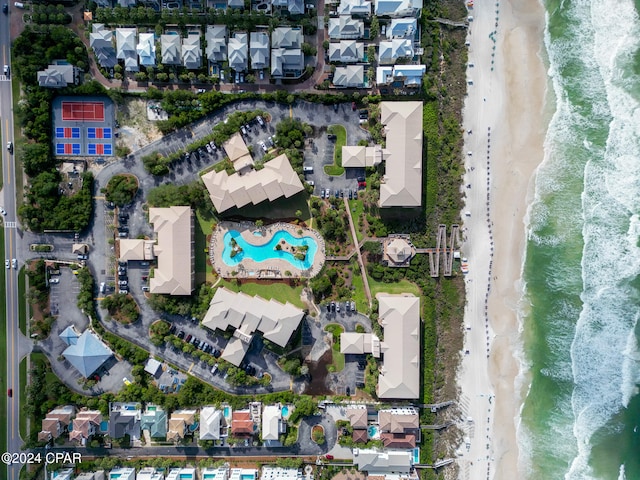 drone / aerial view with a beach view and a water view