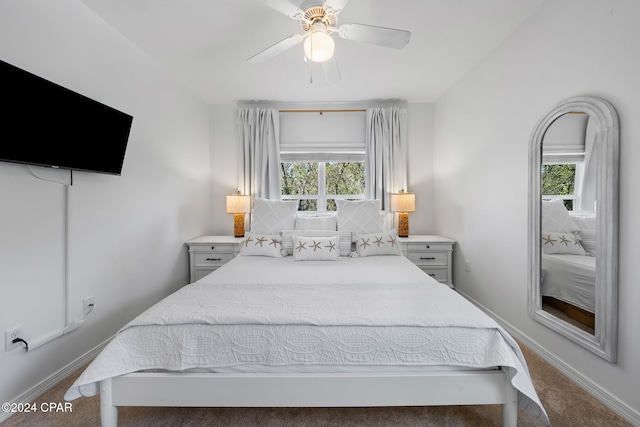 bedroom with multiple windows, carpet, and ceiling fan