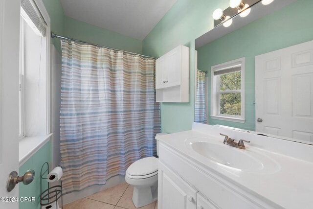 bathroom with vanity, tile patterned floors, toilet, and a shower with curtain