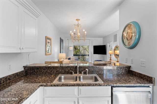 kitchen with white cabinetry, decorative light fixtures, a notable chandelier, sink, and stainless steel dishwasher