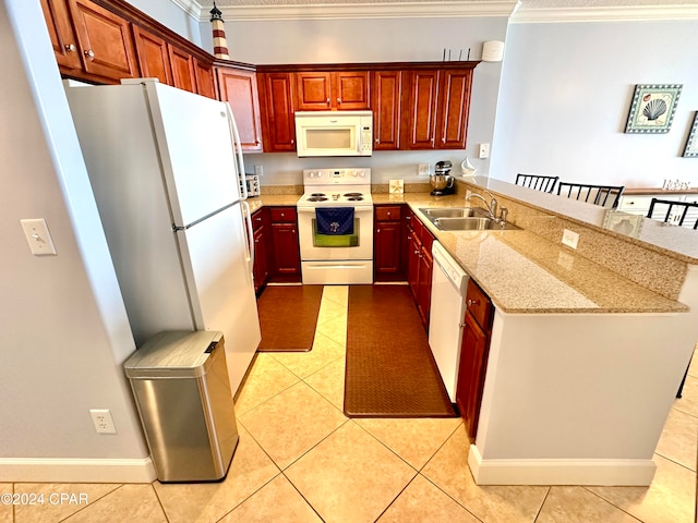 kitchen featuring white appliances, light stone counters, ornamental molding, and sink