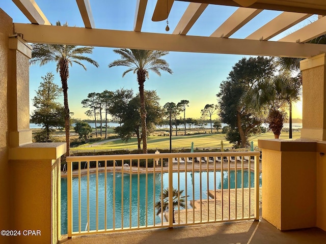 pool at dusk with a water view