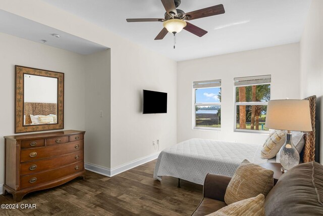 bedroom featuring dark wood-type flooring and ceiling fan