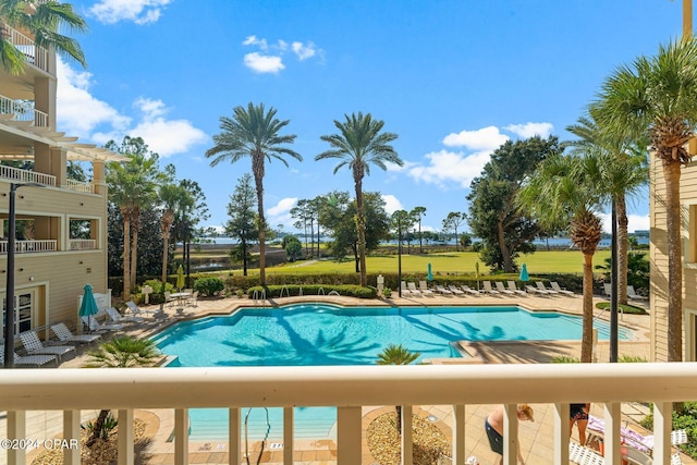 view of swimming pool with a patio and a lawn