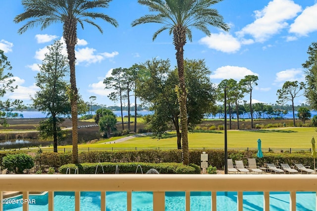 view of pool with a water view