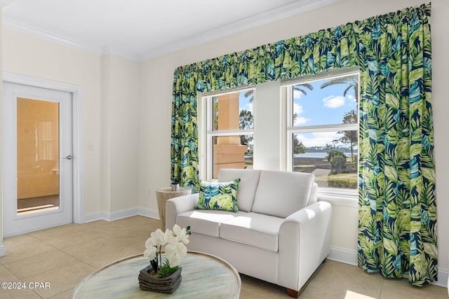 sitting room featuring crown molding and light tile patterned flooring