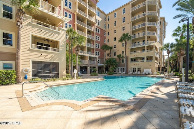 view of pool with a ceiling fan