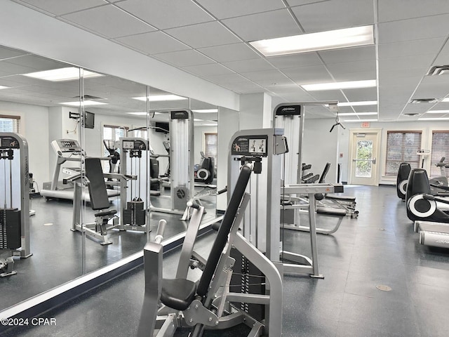 exercise room featuring a drop ceiling