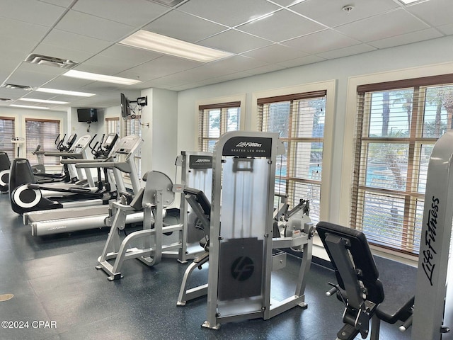 exercise room featuring a paneled ceiling and visible vents