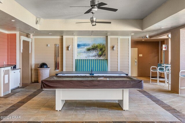 playroom featuring pool table, a textured ceiling, and ceiling fan