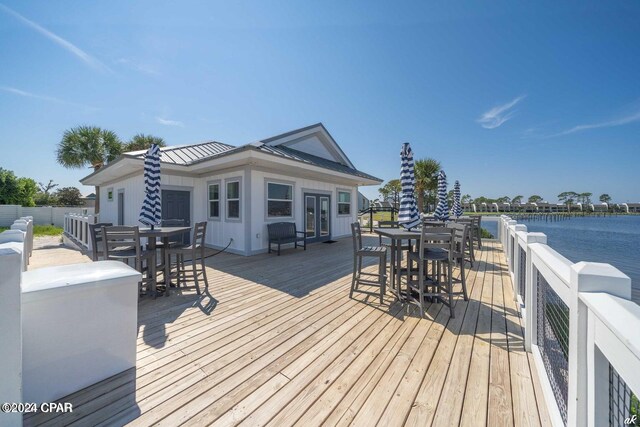 wooden terrace with a water view