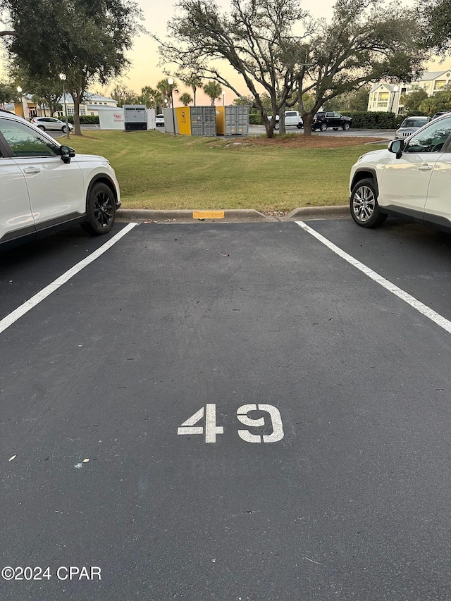 parking at dusk with a lawn