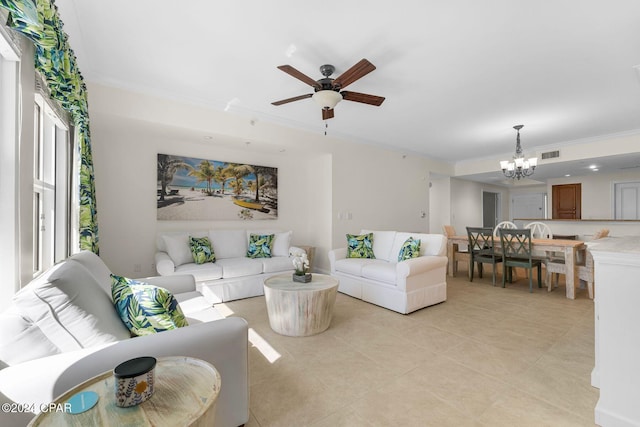 living room with crown molding, light tile patterned flooring, and ceiling fan with notable chandelier