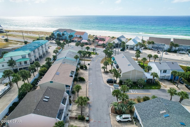 drone / aerial view featuring a view of the beach and a water view