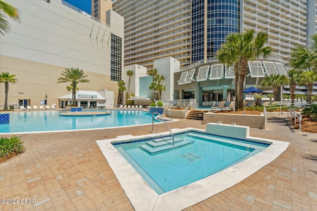 view of pool featuring a patio