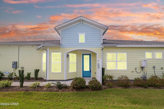 view of front of property with a yard