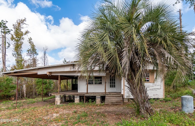 rear view of house with a carport