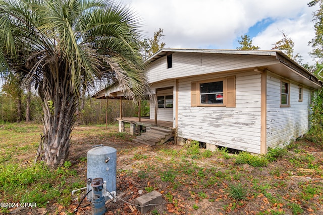 view of front of property featuring a wooden deck