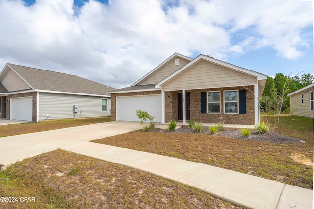 view of front of home featuring a porch and a garage