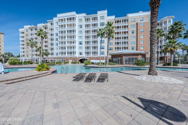 view of swimming pool featuring a patio