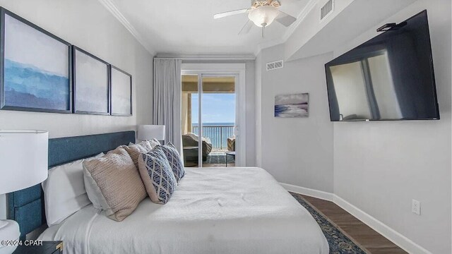 bedroom featuring ceiling fan, hardwood / wood-style flooring, and crown molding