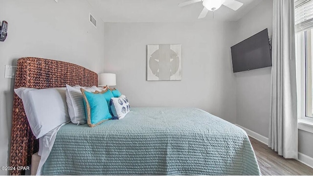 bedroom featuring light wood-type flooring and ceiling fan