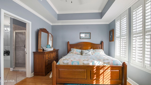 tiled bedroom featuring multiple windows, crown molding, and ensuite bathroom