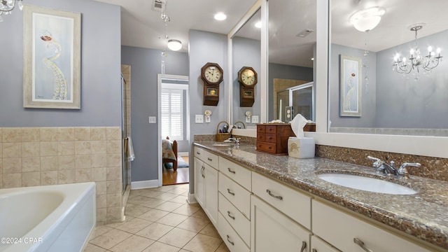 bathroom with shower with separate bathtub, vanity, tile patterned floors, and an inviting chandelier