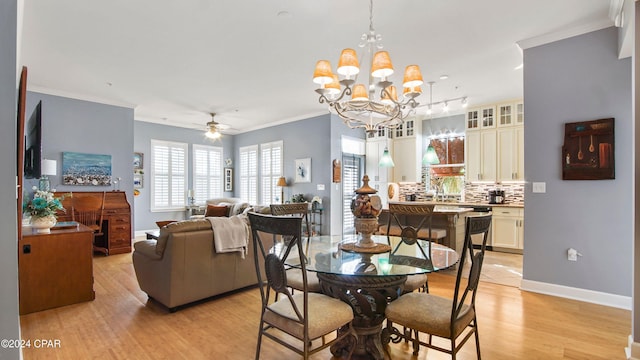 dining space featuring ornamental molding, ceiling fan with notable chandelier, and light hardwood / wood-style floors