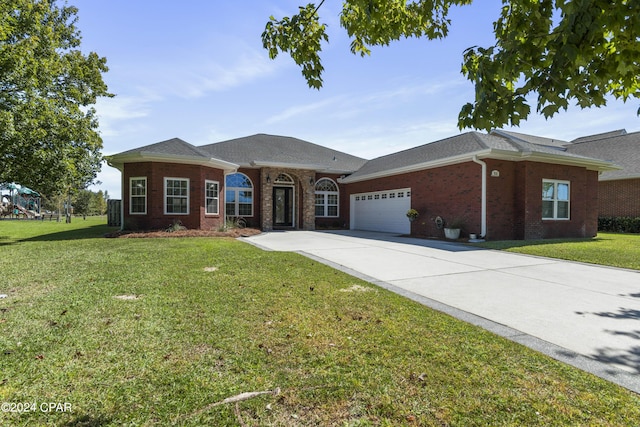 ranch-style home with a front yard and a garage