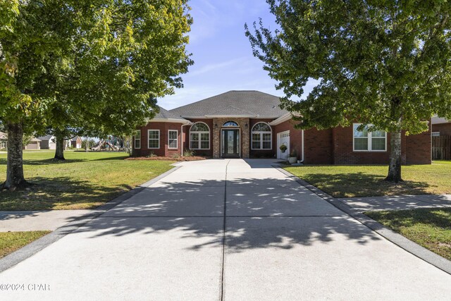 ranch-style house with a front yard