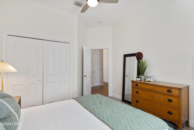 bedroom with ceiling fan and a closet