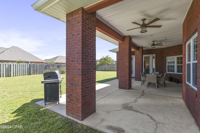 view of patio / terrace with area for grilling and ceiling fan