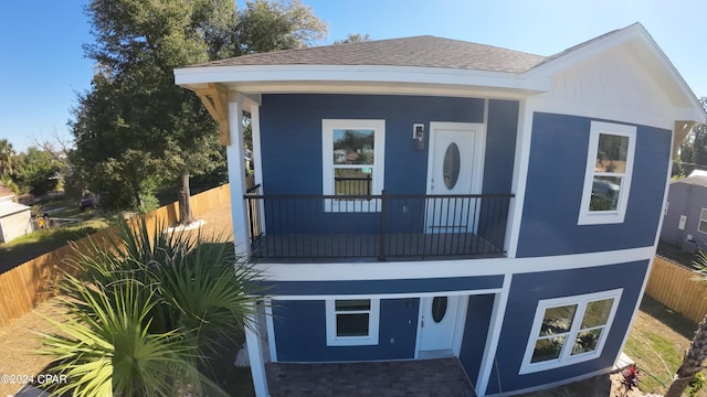 view of front of house with a balcony