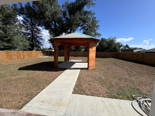 view of yard featuring a gazebo and a patio area