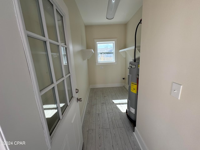 utility room with electric water heater