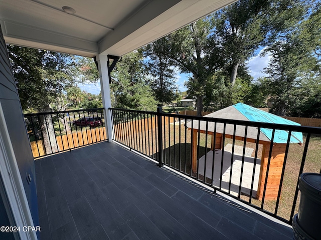 wooden terrace featuring a pool