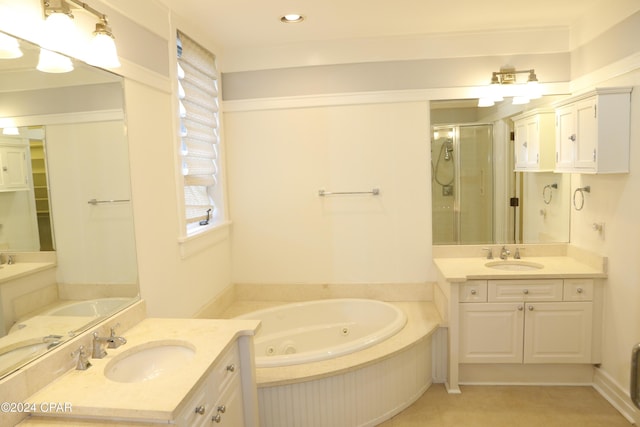 bathroom featuring vanity, tile patterned floors, and plus walk in shower