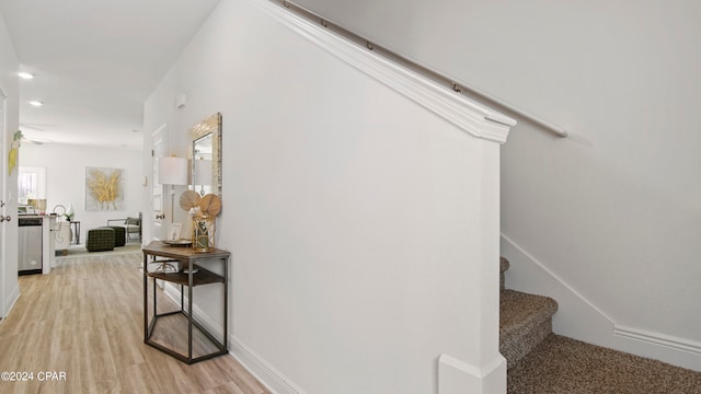 hallway with light wood-type flooring