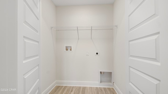 laundry room featuring light hardwood / wood-style floors, electric dryer hookup, and hookup for a washing machine