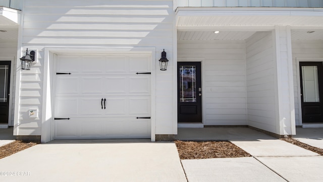 property entrance with a garage