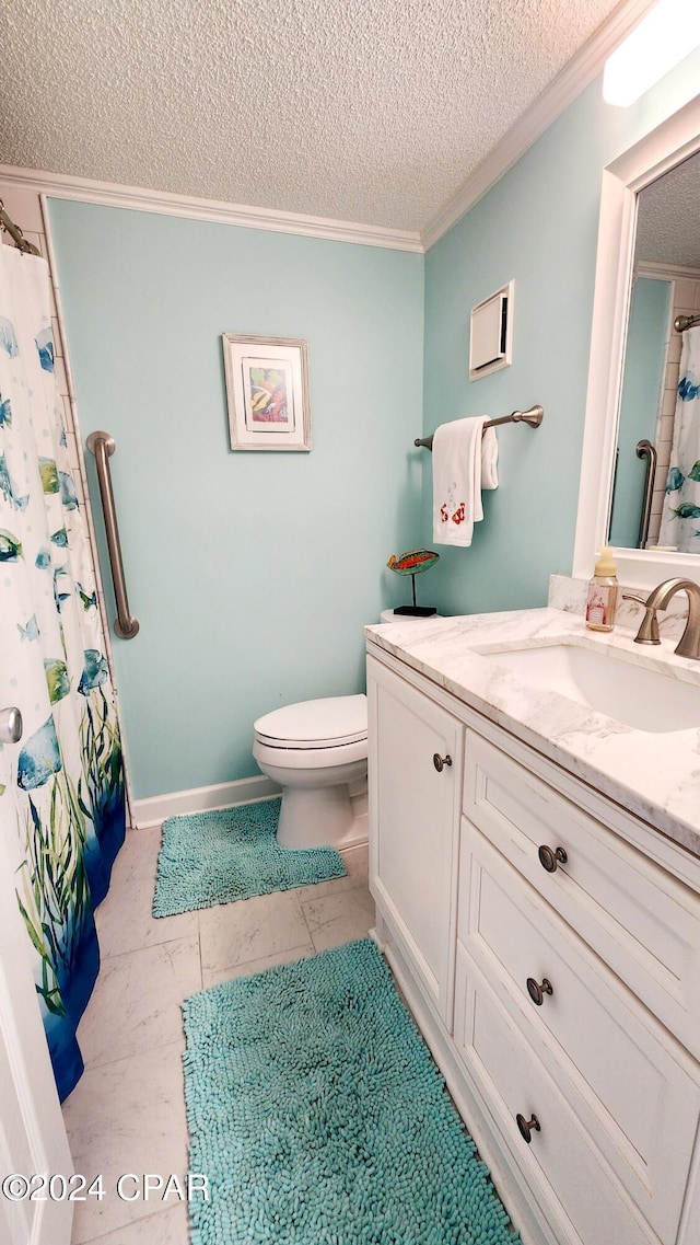 bathroom featuring vanity, a textured ceiling, toilet, and tile patterned floors