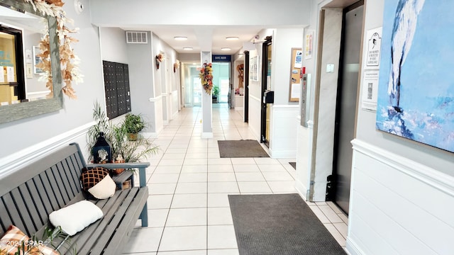 corridor featuring light tile patterned floors