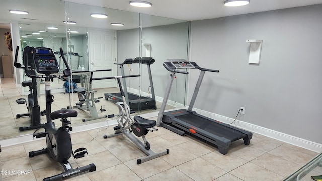 exercise area featuring light tile patterned floors